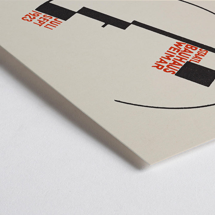 Closeup detail of Dörte Helm Bauhaus Weimar exhibition poster with bold black geometry and red typography on warm beige background