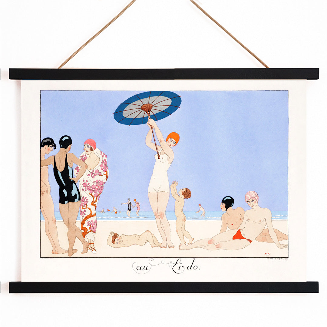 Art Deco beach scene with women children and people in swimsuits relaxing and playing on the beach Au Lido Plate by George Barbier, with wooden magnetic frame on white background