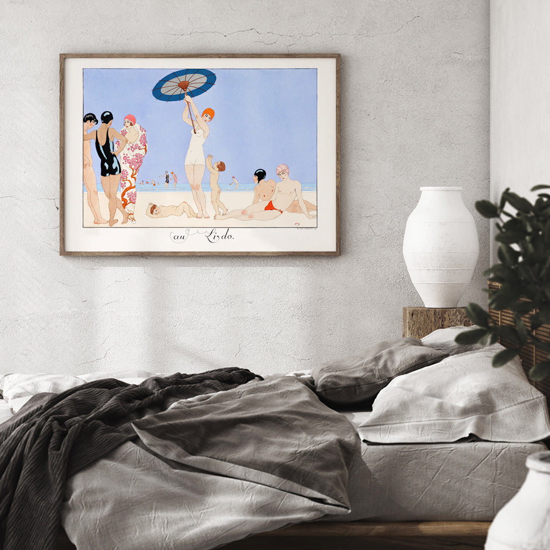 Art Deco beach scene with women children and people in swimsuits relaxing and playing on the beach Au Lido Plate by George Barbier, framed and displayed in home decor