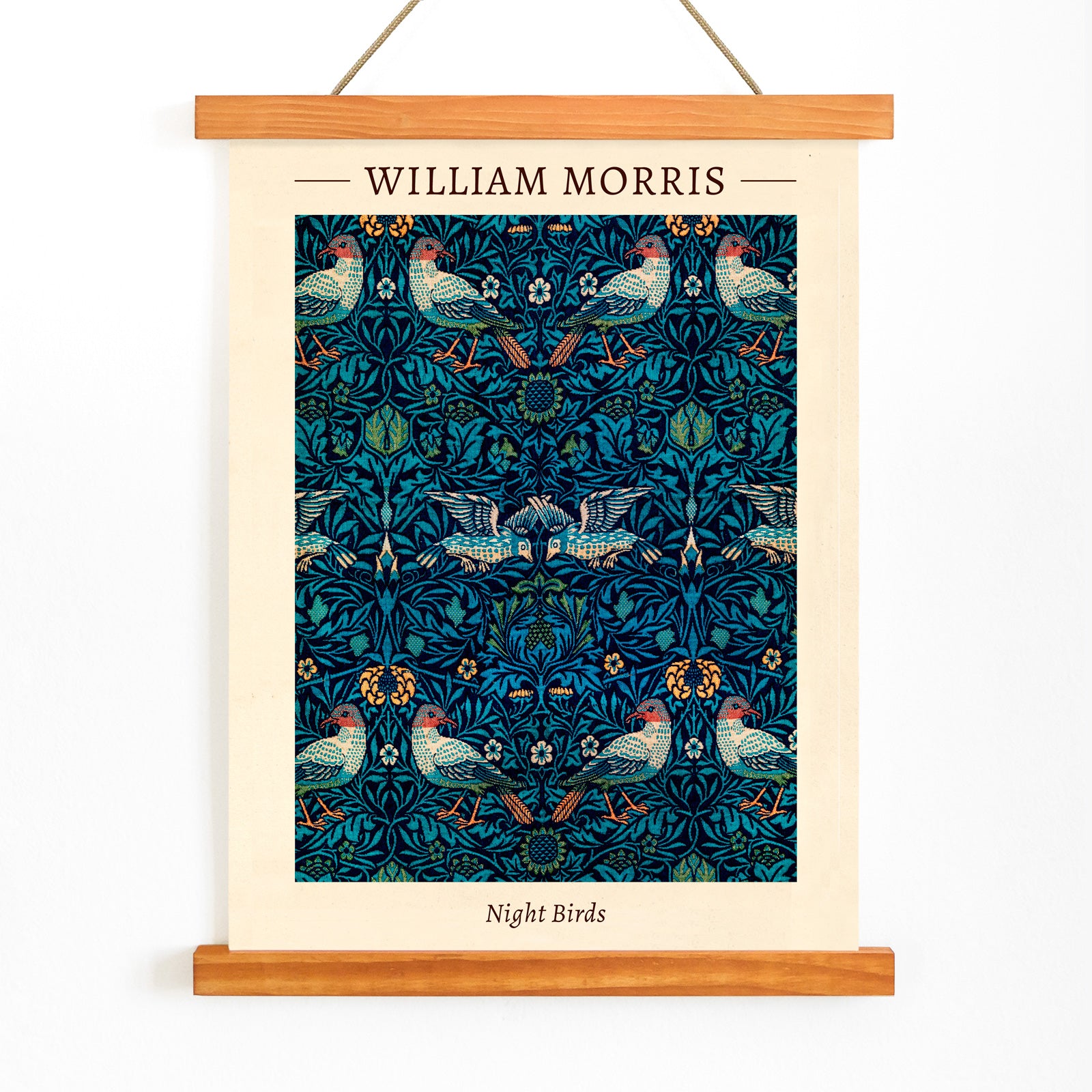 Night Birds by William Morris colorful patterned illustration and poster with intricate birds and floral designs in rich blue and green tones, with wooden magnetic frame on white background