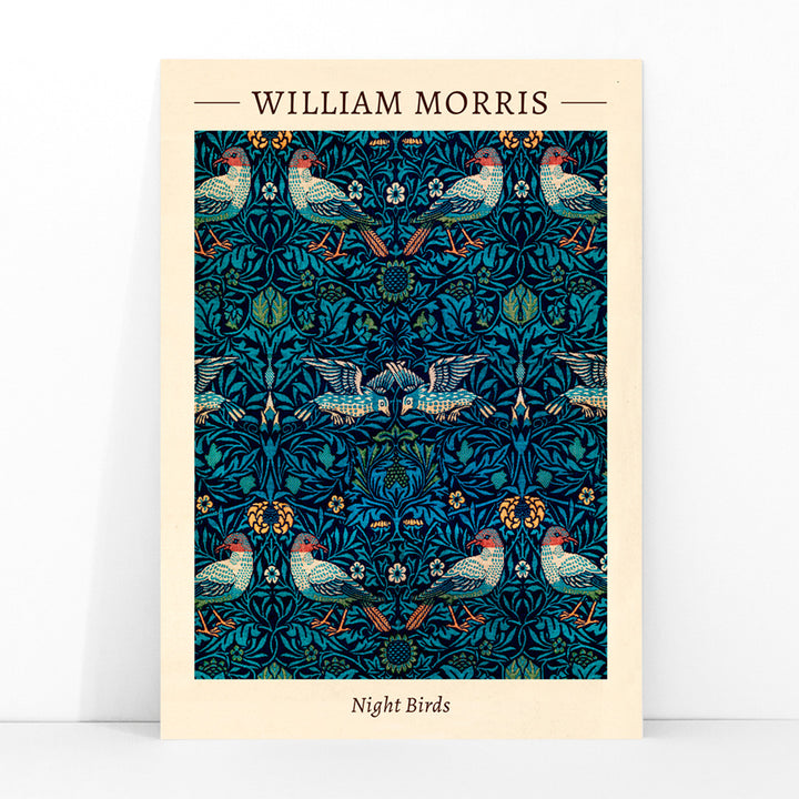Night Birds by William Morris colorful patterned illustration and poster with intricate birds and floral designs in rich blue and green tones, framed and displayed in modern living room decor