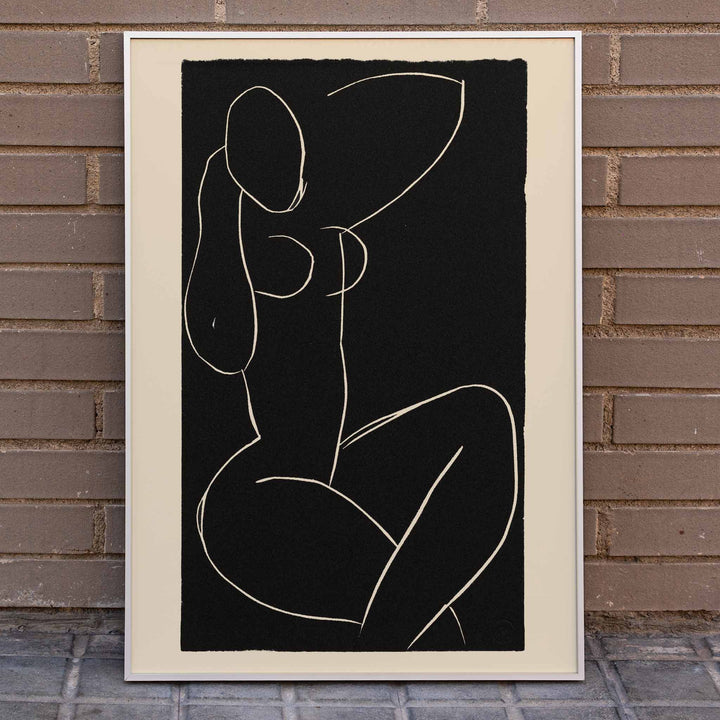 Henri Matisse Seated Nude with Crossed Legs I poster minimalist black and white nude line drawing on dark background, framed and displayed in home decor
