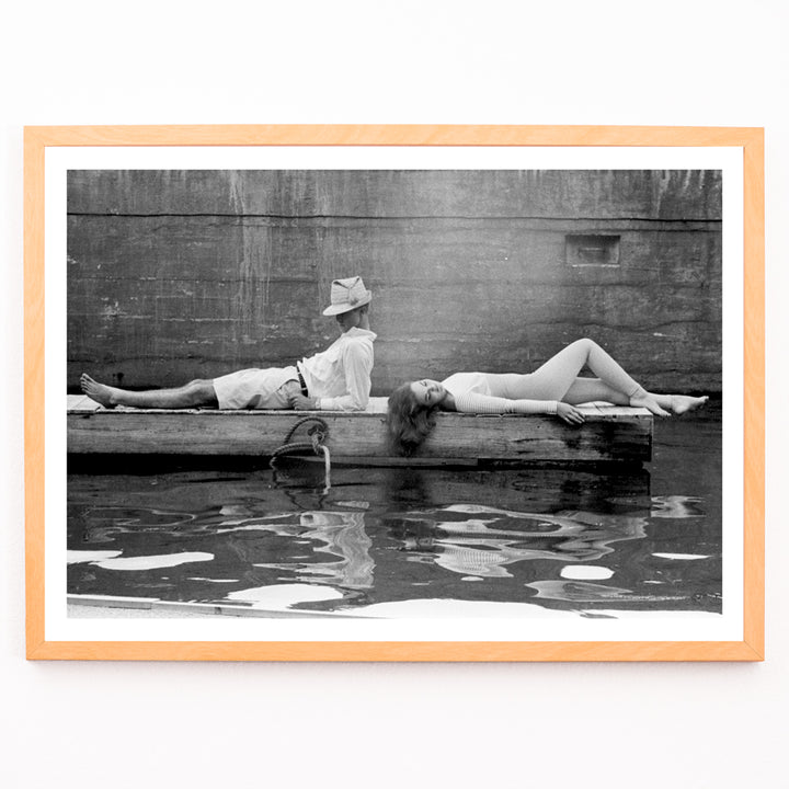 Closeup detail of Marquess of Tavistock Henry Robin Ian Russell and Henrietta Tiarks relaxing on a dock in Bermuda by Toni Frissell poster