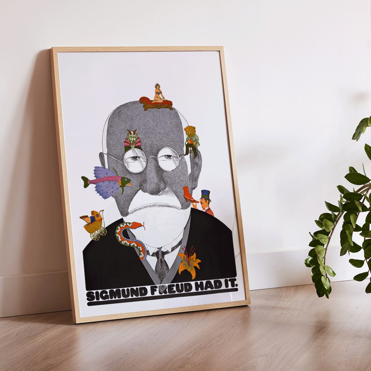 Surreal Sigmund Freud portrait and poster with colorful whimsical illustrations by Seymour Chwast, framed and displayed in home decor