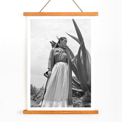 Frida Kahlo standing by agave plant black and white photograph and poster by Toni Frissell titled Senora Diego Rivera, with wooden magnetic frame on white background