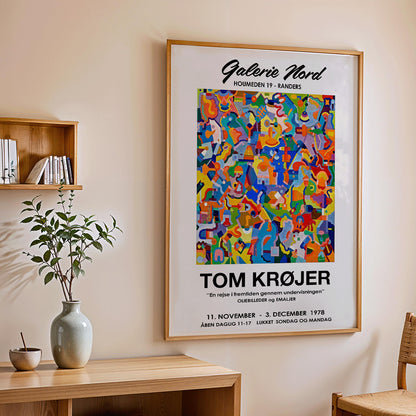 Colorful abstract artwork exhibition poster by Tom Krojer titled En rejse i fremtiden gennem undervisningen at Galerie Nord featuring bold geometric shapes, framed and displayed in home decor