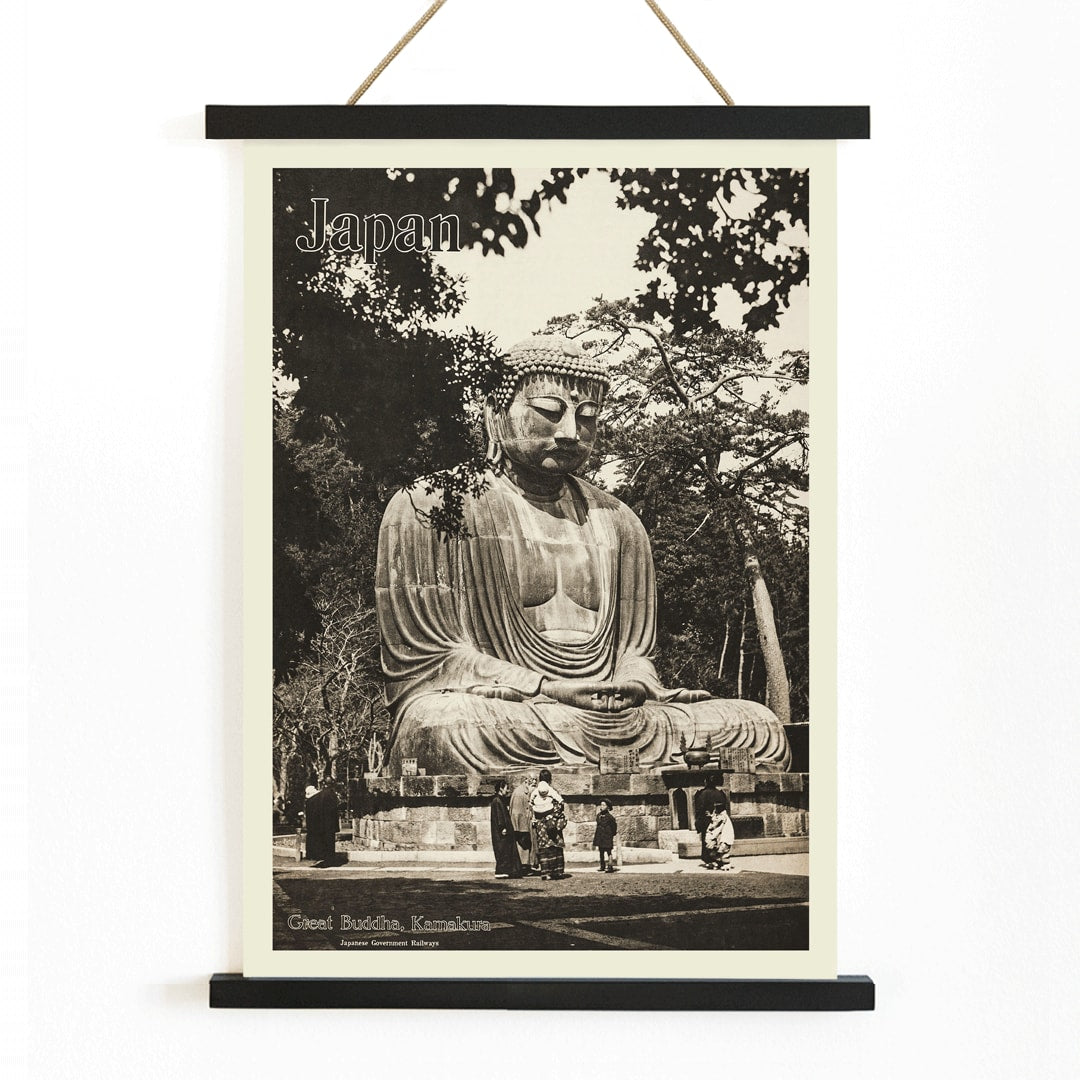 Japan travel poster by Japanese Government Railways showing the Great Buddha in Kamakura with people near the large statue, with wooden magnetic frame on white background