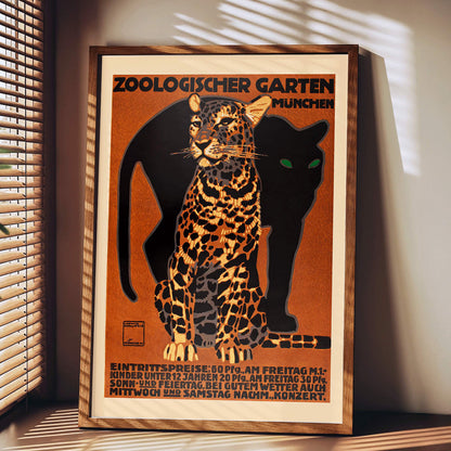 Leopard and black panther poster for Zoologischer Garten München by Ludwig Hohlwein featuring bold text artwork, framed and displayed in modern living room decor