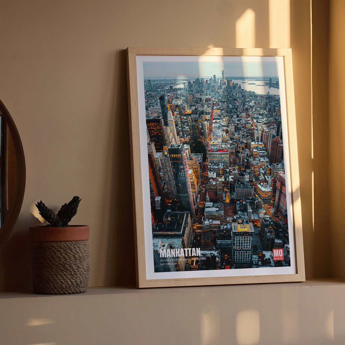 Aerial view and poster of Manhattan skyline in New York by Mo Art Gallery, framed and displayed in modern living room decor