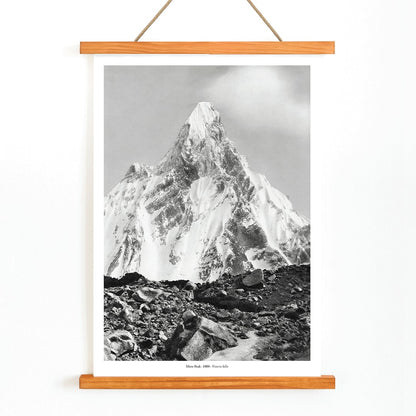 Mitre Peak surrounded by rocky terrain and snowy peak seen from Baltoro Glacier by Vittorio Sella, with wooden magnetic frame on white background