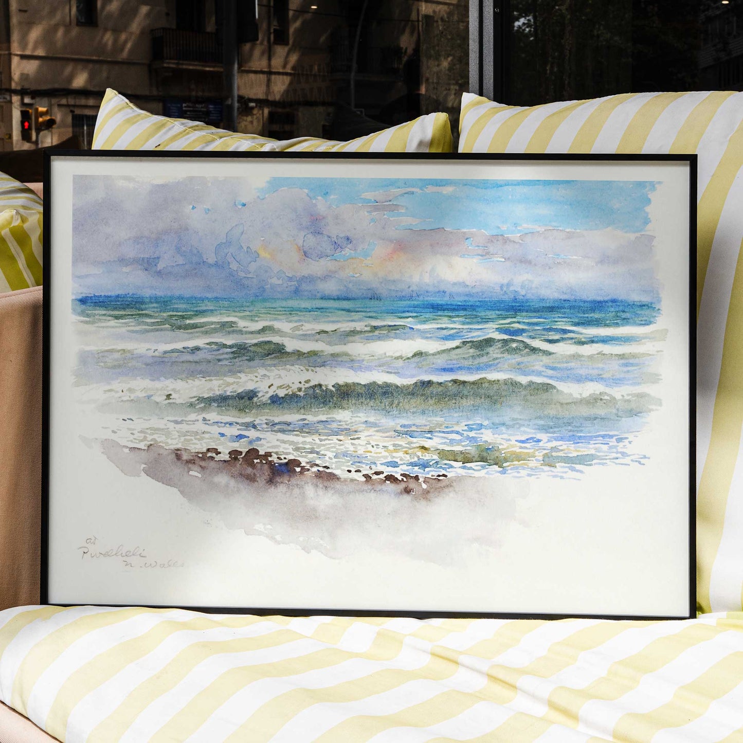 Seascape painting and seaside landscape with waves at Pwllheli North Wales by George Elbert Burr on a poster showing clouds, framed and displayed in home decor