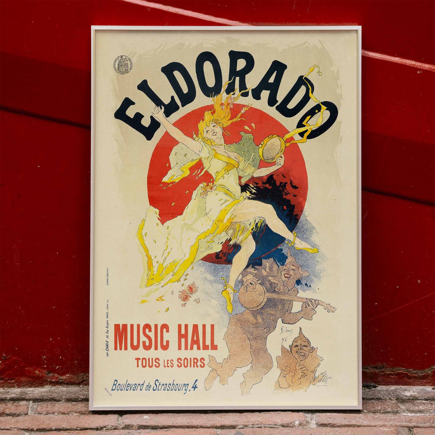 Colorful cabaret poster of Eldorado Music Hall by Jules Cheret showing a lively dancing woman in yellow with musicians and bold colorful graphics, framed and displayed in home decor