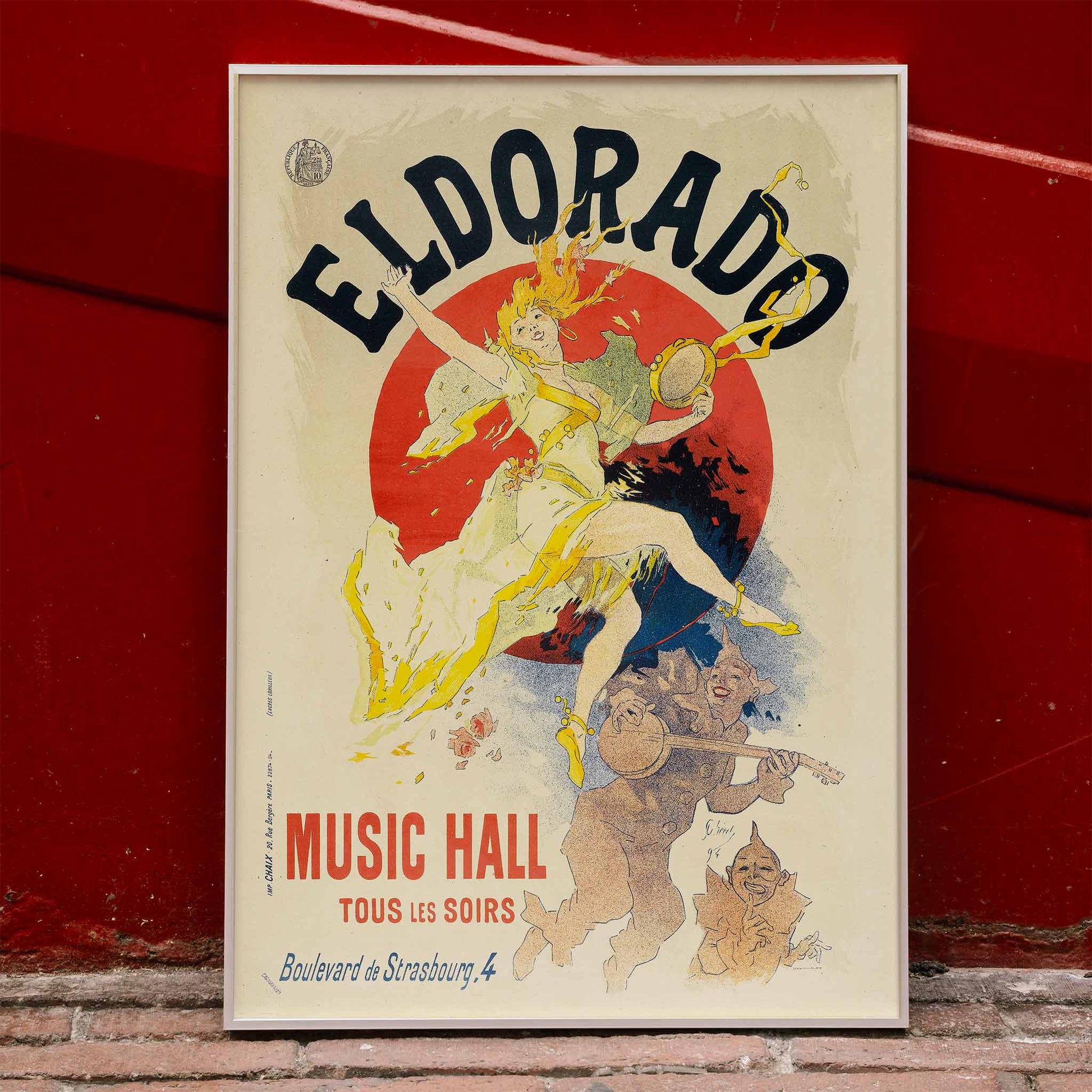 Colorful cabaret poster of Eldorado Music Hall by Jules Cheret showing a lively dancing woman in yellow with musicians and bold colorful graphics, framed and displayed in home decor