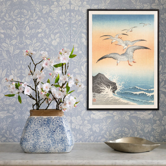 Five seagulls flying over turbulent sea with waves and rocky shore artwork by Ohara Koson, framed and displayed in home decor