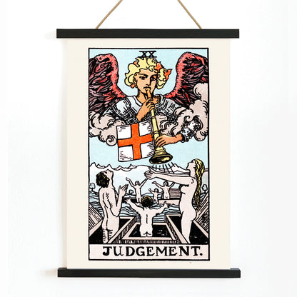 Judgement tarot card by Rider Waite showing an angel with a trumpet and people rising from graves poster, with wooden magnetic frame on white background