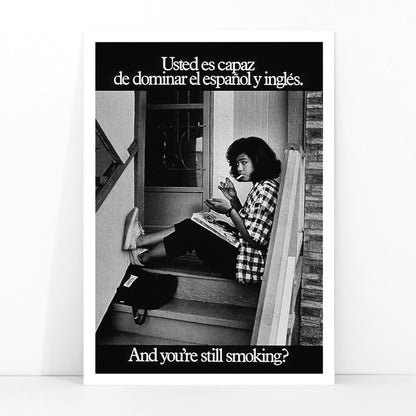 Young woman reading and smoking on stairs in bilingual anti-smoking poster by US Department of Health and Human Services titled Usted es capaz de dominar el español y inglés and you are still smoking, framed and displayed in modern living room decor