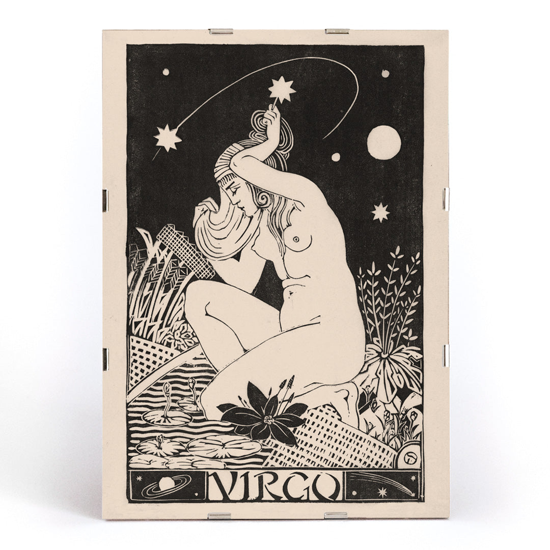 Art Nouveau poster of a nude Virgo woman with stars lilies and plants from Zodiac signs by Henri van der Stok, framed and displayed in modern living room decor